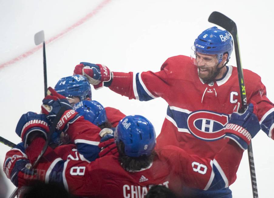 Montreal Canadiens celebrate a goal by Cole Caufield against the against Vegas Golden Knights d ...