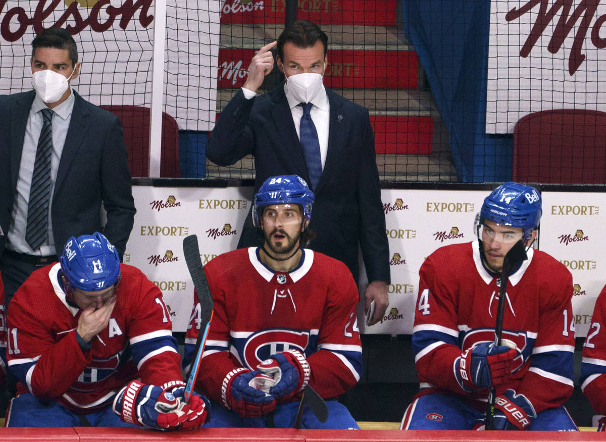 Montreal Canadiens substitute coach Luke Richardson stands behind the team bench during the fir ...