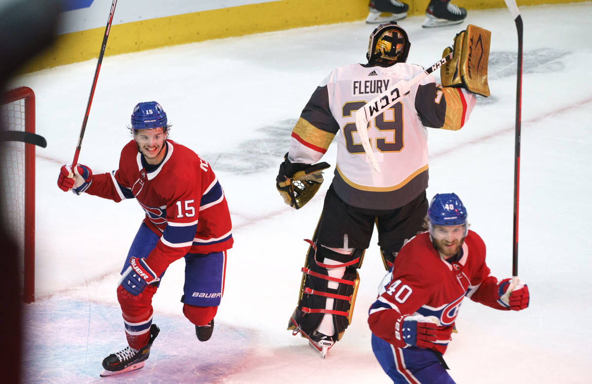 Montreal Canadiens' Jesperi Kotkaniemi, left, and Joel Armia celebrate a goal by Josh Anderson ...