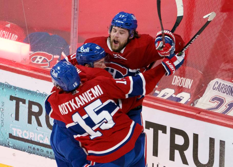 Montreal Canadiens' Josh Anderson celebrates with Paul Byron and Jesperi Kotkaniemi after scori ...