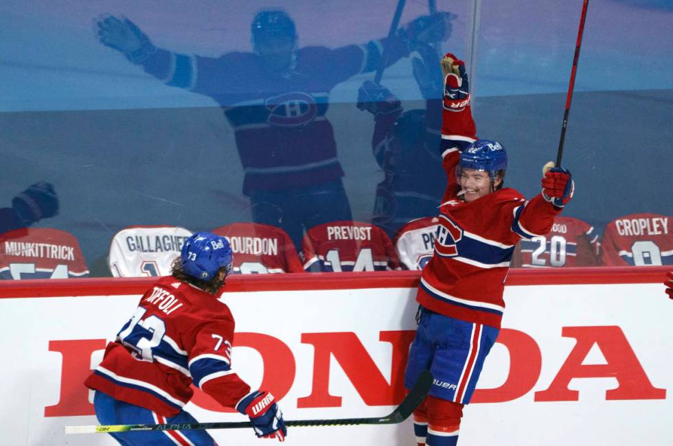 Montreal Canadiens' Cole Caufield celebrates his goal against the Montreal Canadiens with Tyler ...