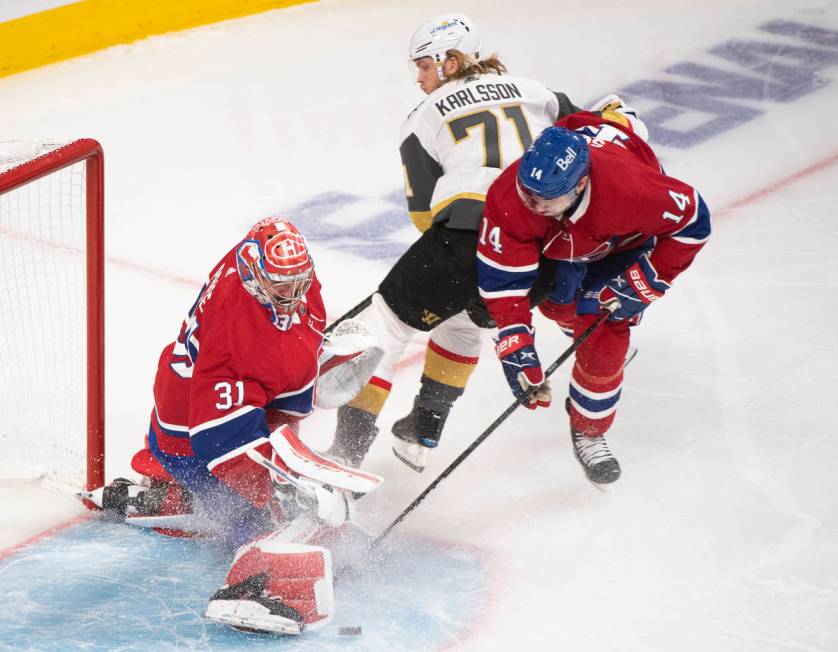 Montreal Canadiens goaltender Carey Price stops Vegas Golden Knights' William Karlsson (71) as ...