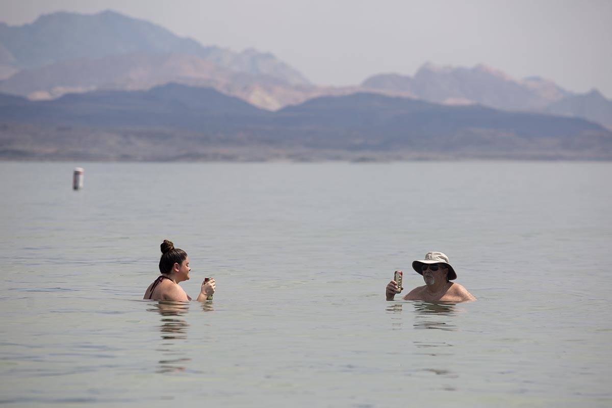 Beach-goers cool off in the water along Boulder Beach at Lake Mead on Saturday, June 19, 2021, ...