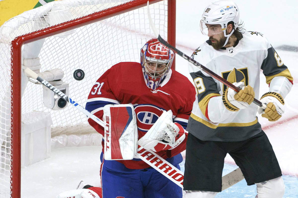 Montreal Canadiens goaltender Carey Price stops a shot as Vegas Golden Knights' Alex Tuch looks ...