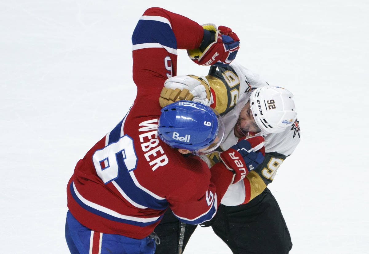Montreal Canadiens' Shea Weber and Vegas Golden Knights' Tomas Nosek (92) fight during the seco ...