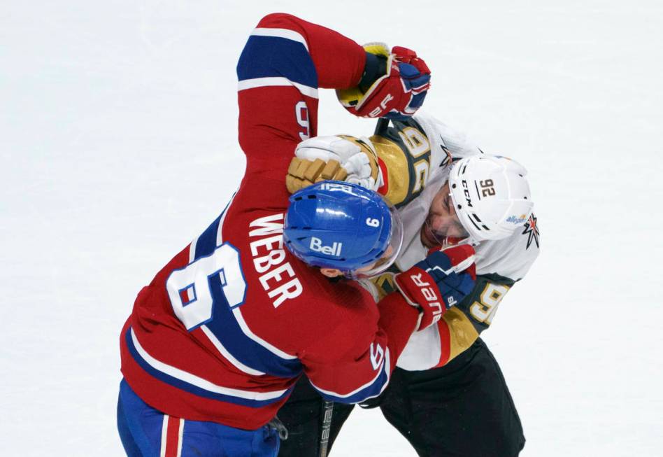 Montreal Canadiens' Shea Weber and Vegas Golden Knights' Tomas Nosek (92) fight during the seco ...
