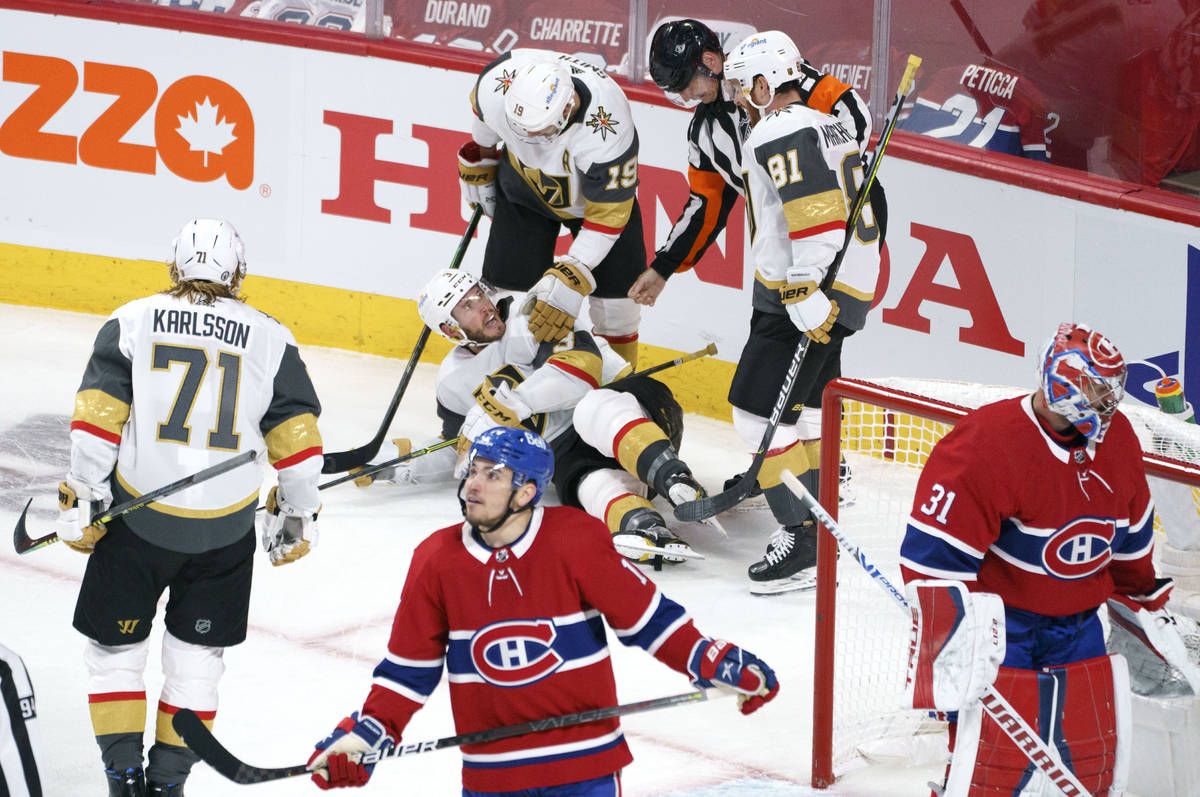 Vegas Golden Knights' Brayden McNabb falls to the ice after scoring past Montreal Canadiens goa ...
