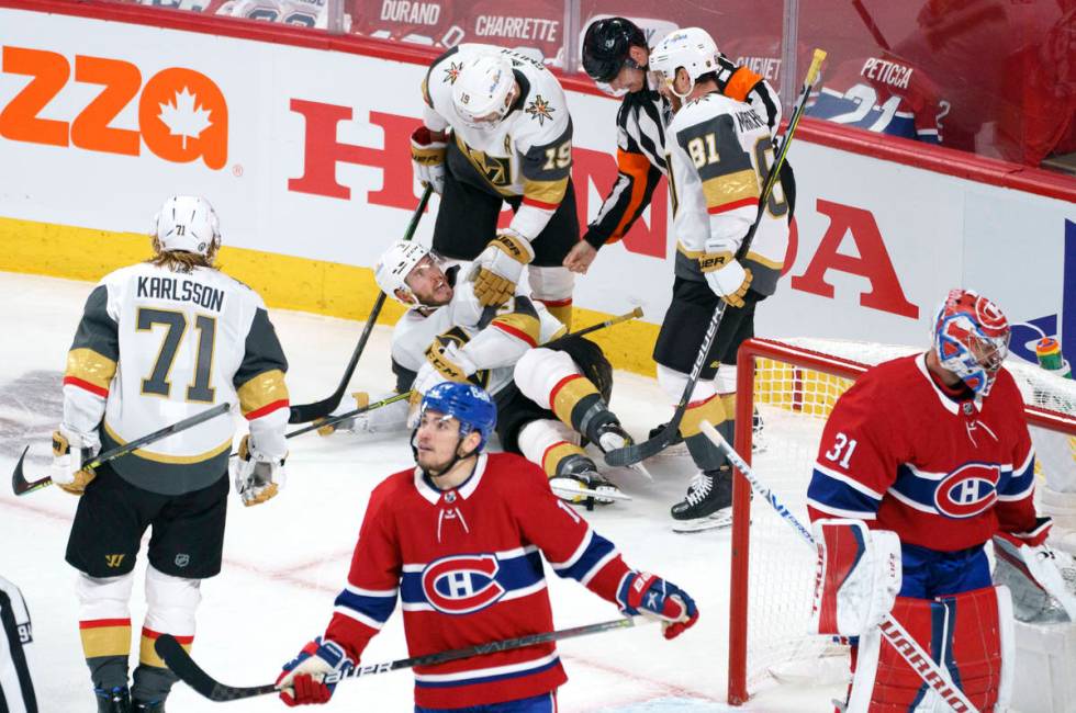 Vegas Golden Knights' Brayden McNabb falls to the ice after scoring past Montreal Canadiens goa ...