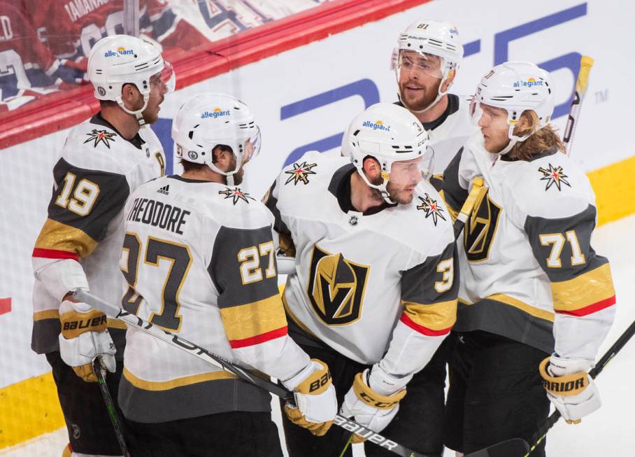Vegas Golden Knights' Brayden McNabb (3) celebrates his goal against the Montreal Canadiens wit ...