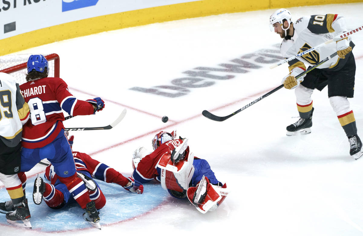 Vegas Golden Knights' Nicolas Roy scores past Montreal Canadiens goaltender Carey Price during ...