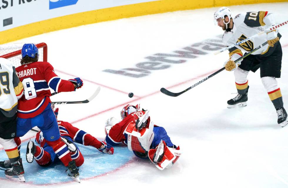 Vegas Golden Knights' Nicolas Roy scores past Montreal Canadiens goaltender Carey Price during ...