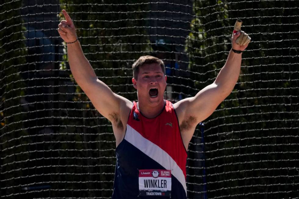 Rudy Winkler reacts after setting an American record during the finals of the men's hammer thro ...