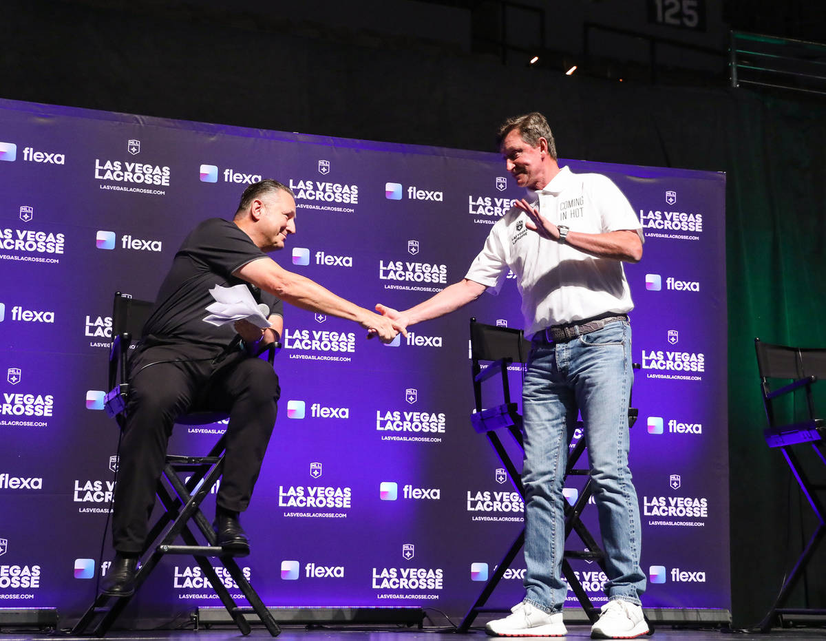 Nick Sakiewicz, commissioner of the National Lacrosse League, left, shakes hands with Wayne Gre ...