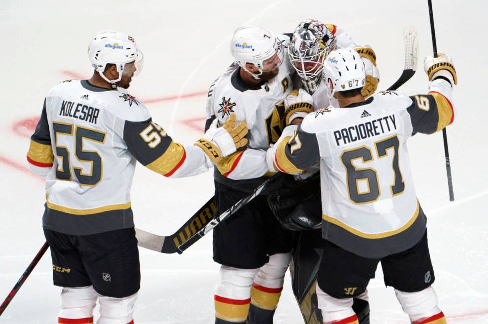 Vegas Golden Knights' Keegan Kolesar, Alex Pietrangelo and Max Pacioretty, left to right, gathe ...