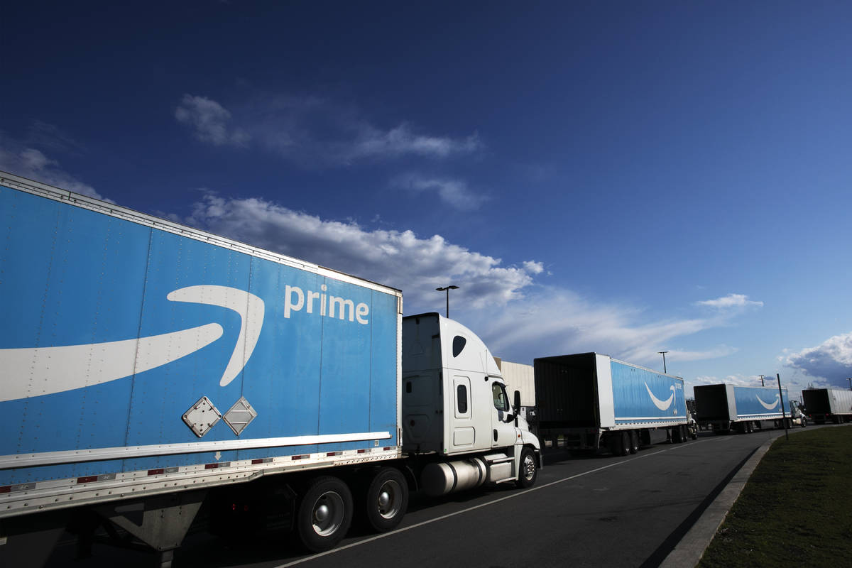 This April 21, 2020 file photo shows Amazon tractor trailers line up outside the Amazon Fulfill ...