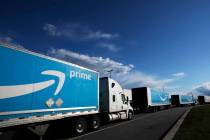 This April 21, 2020 file photo shows Amazon tractor trailers line up outside the Amazon Fulfill ...