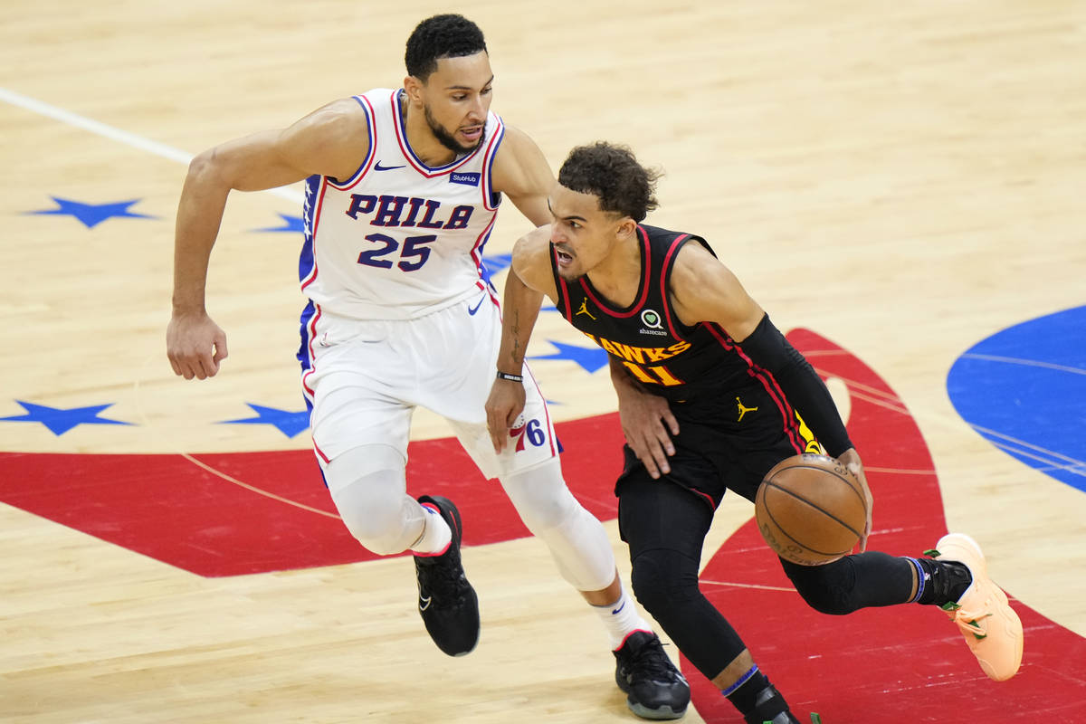 Philadelphia 76ers' Matisse Thybulle, right, blocks a shot by Atlanta Hawks' Trae Young during ...