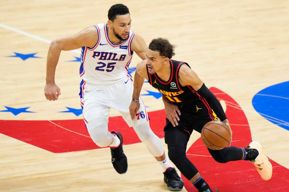 Philadelphia 76ers' Matisse Thybulle, right, blocks a shot by Atlanta Hawks' Trae Young during ...