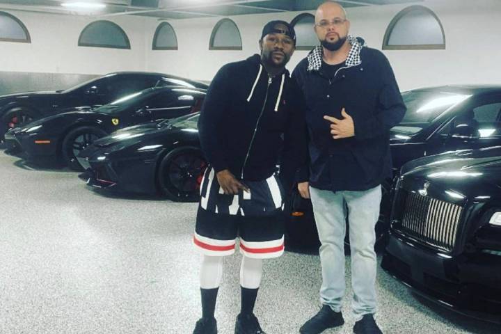 Floyd Mayweather poses with Josh “Chop” Towbin, the owner of Towbin Auto Group. The dealers ...