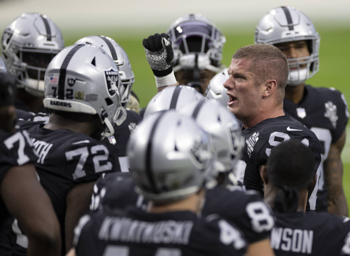 Las Vegas Raiders defensive end Carl Nassib (94) fires up his team before the start of an NFL f ...
