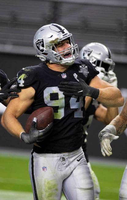 Las Vegas Raiders defensive end Carl Nassib (94) celebrates after intercepting a pass in the fo ...