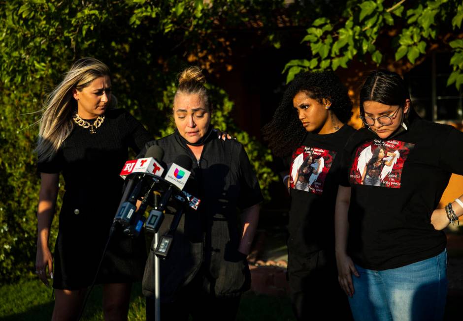 Aracely Palacio, second from left, is comforted by attorney Ofelia Markarian while speaking dur ...