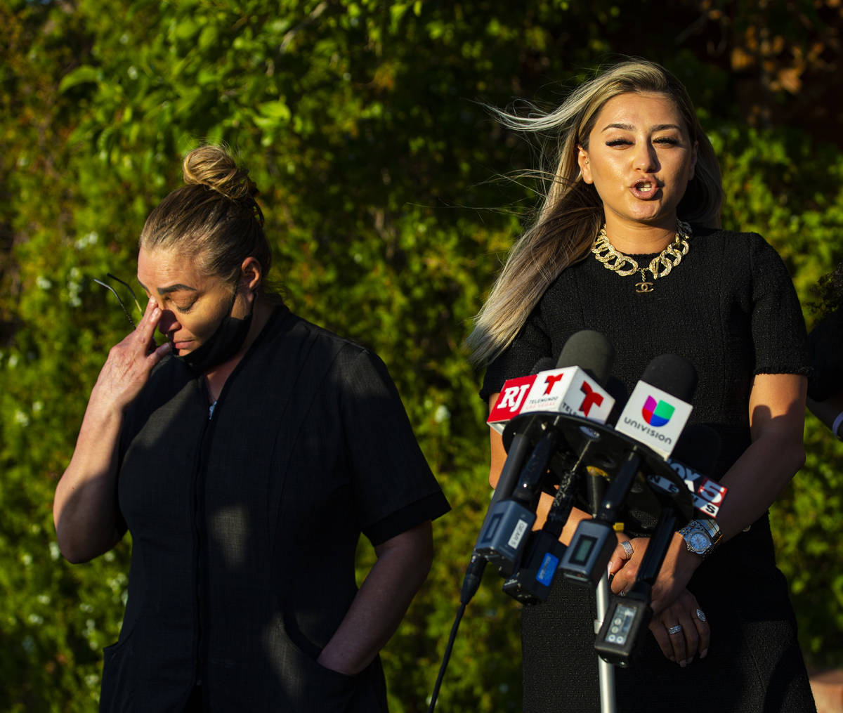 Aracely Palacio, left, wipes a tear as attorney Ofelia Markarian speaks during a news conferenc ...