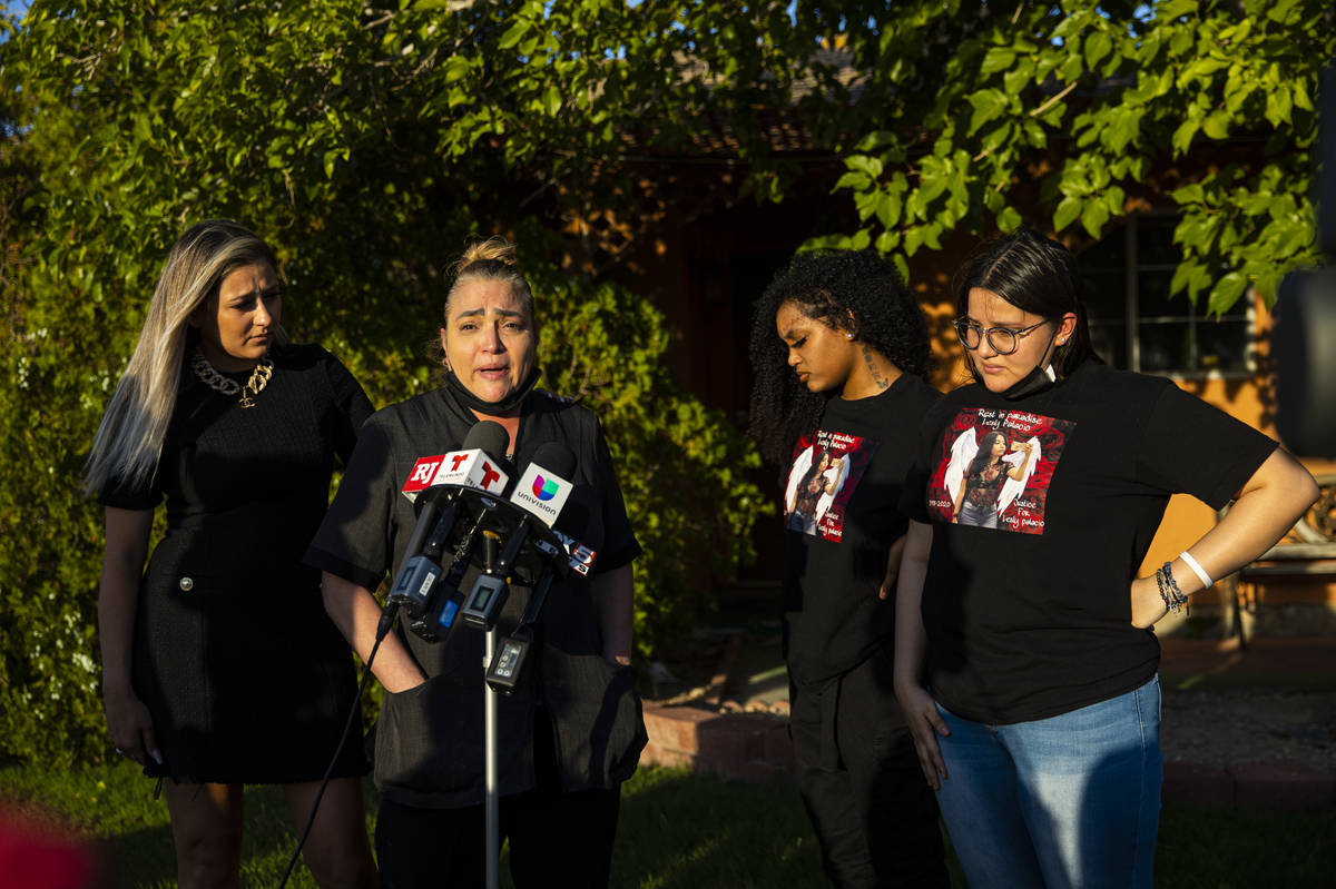 Aracely Palacio, second from left, is comforted by attorney Ofelia Markarian while speaking dur ...