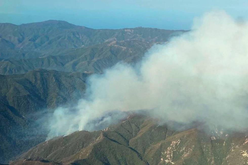 Smoke rises from the Willow Fire near Big Sur, Calif., on Sunday, June 20, 2021. (California In ...