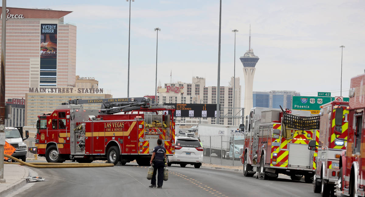 Las Vegas firefighters work a fire off B Street and West Owens Avenue near the railroad tracks ...