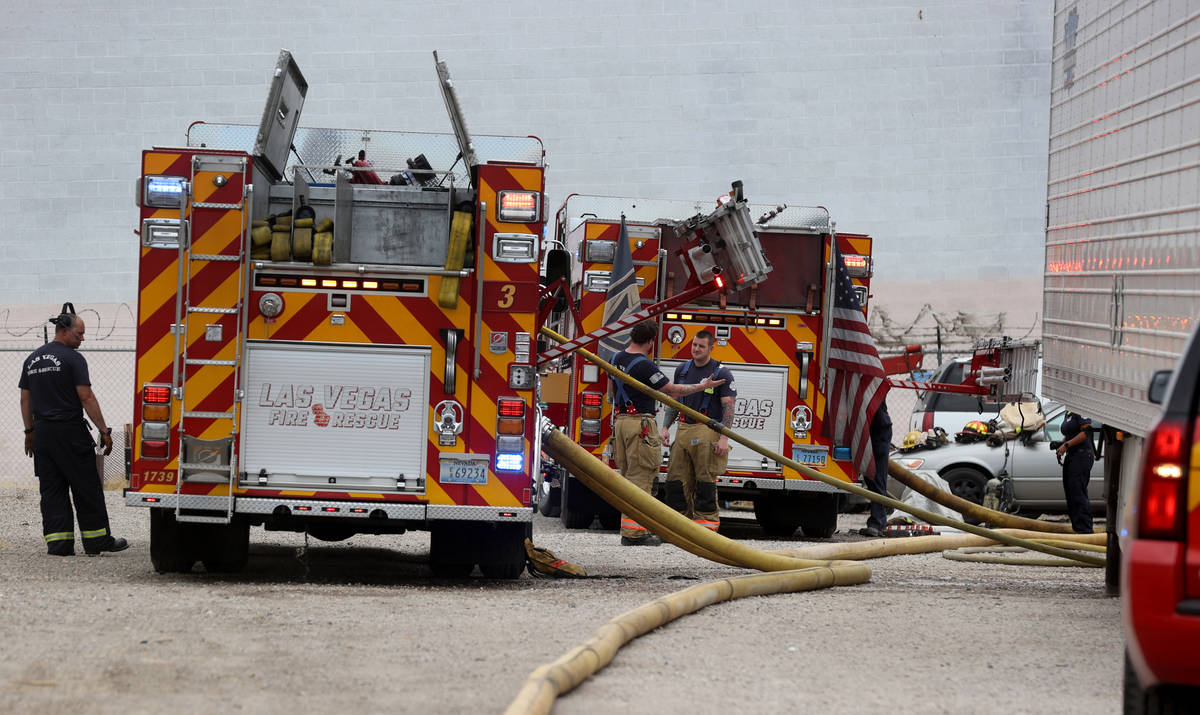 Las Vegas firefighters work a fire off B Street and West Owens Avenue near the railroad tracks ...
