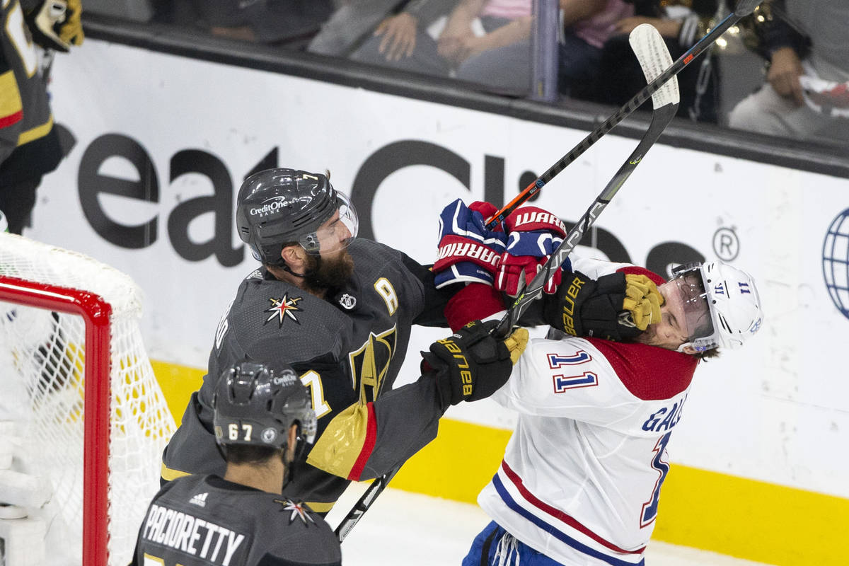 Golden Knights defenseman Alex Pietrangelo (7) punches Canadiens right wing Brendan Gallagher ( ...