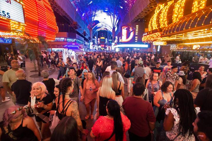 Visitors take in the sites at the Fremont Street Experience during Memorial Day weekend on Satu ...