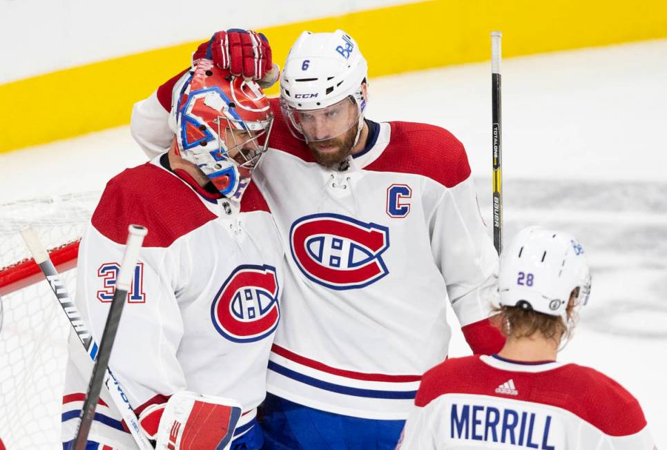 Canadiens goaltender Carey Price (31) is congratulated by Canadiens defenseman Shea Weber (6) a ...