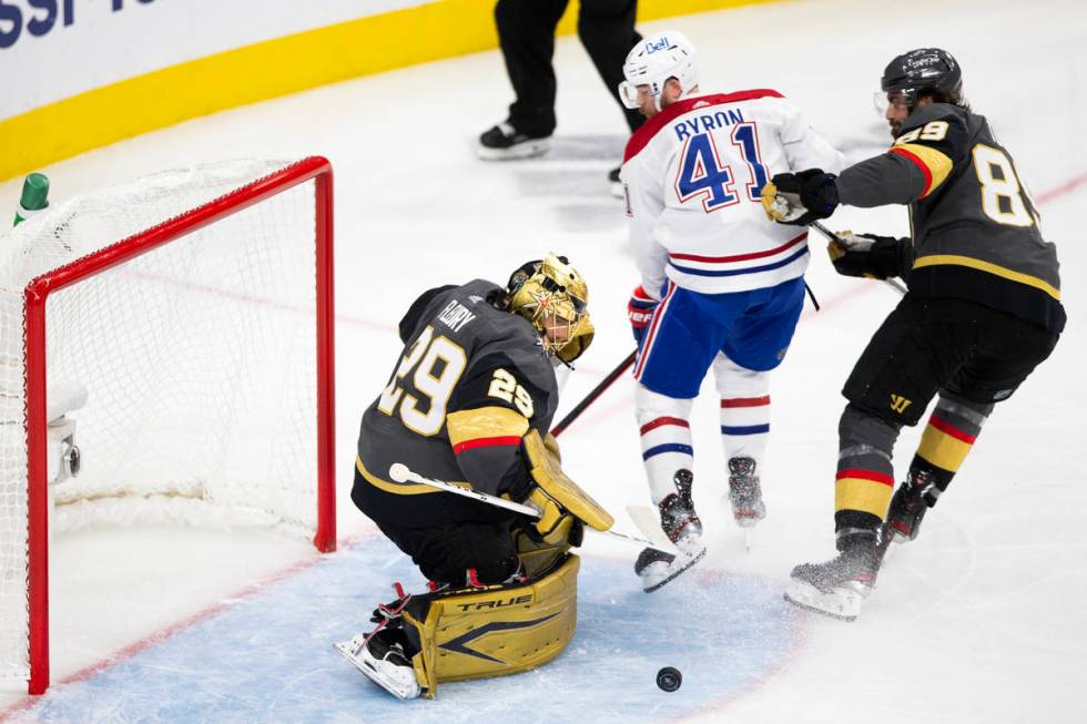Golden Knights goaltender Marc-Andre Fleury (29) saves a shot by Canadiens right wing Paul Byro ...