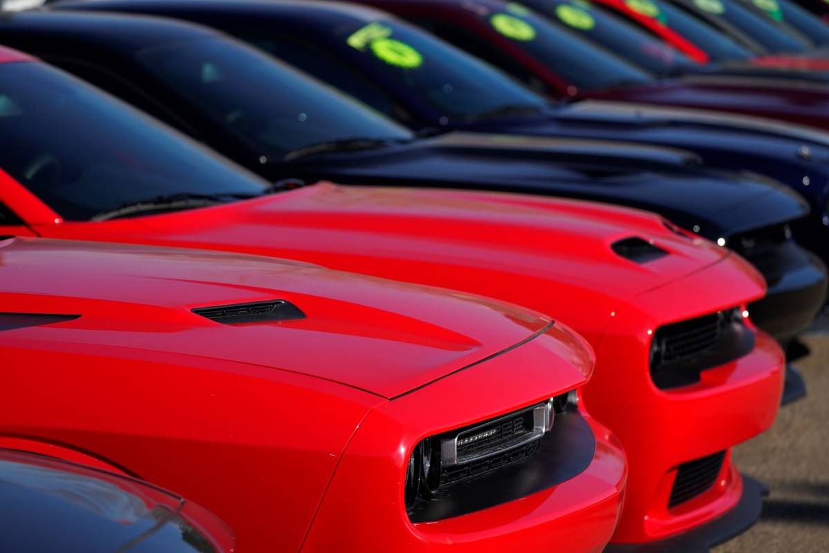 A long line of used Challengers at a Dodge dealership is seen in Littleton, Colo., in 2021. (AP ...