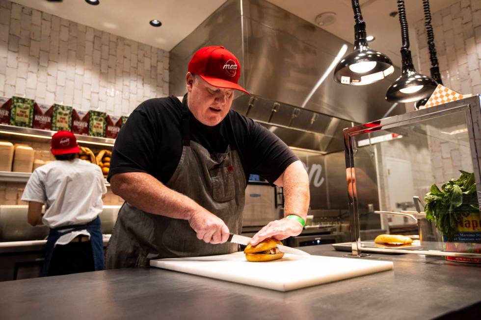 Chef James Trees prepares a chicken parmesan sandwich at Mozz, inside of the Famous Foods Stree ...