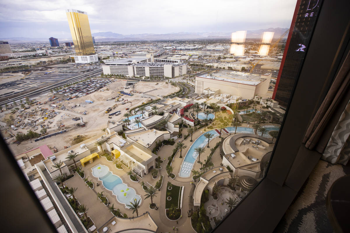 A view of the pool area and beyond is seen from a Conrad suite during a tour of Resorts World a ...