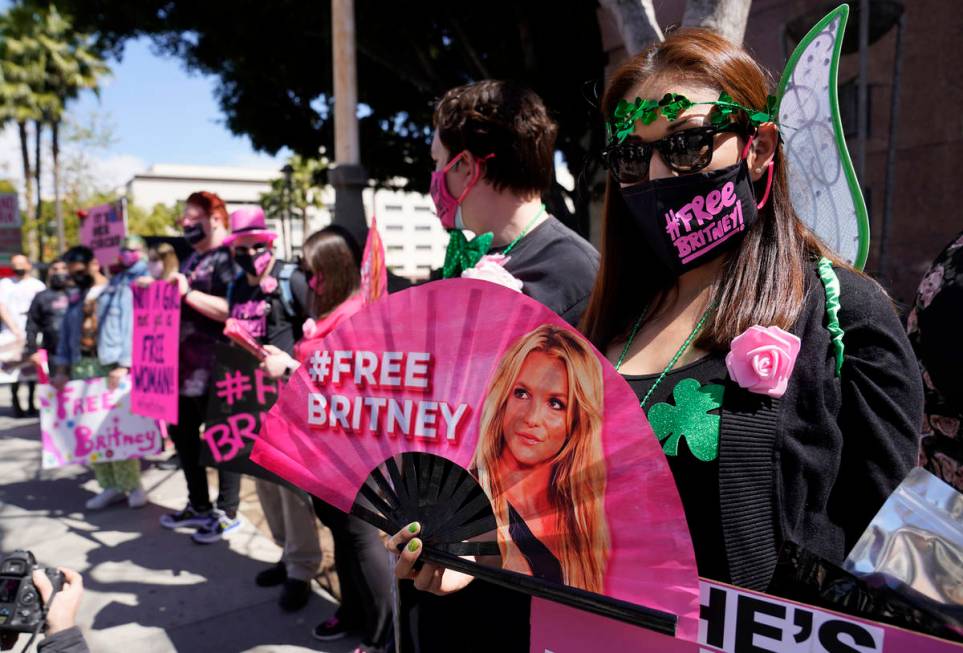 Britney Spears supporter Kiki Norberto holds a hand fan outside a court hearing concerning the ...