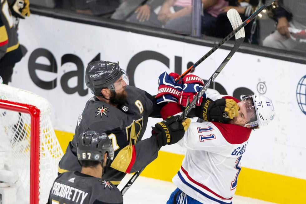 Golden Knights defenseman Alex Pietrangelo (7) punches Canadiens right wing Brendan Gallagher ( ...