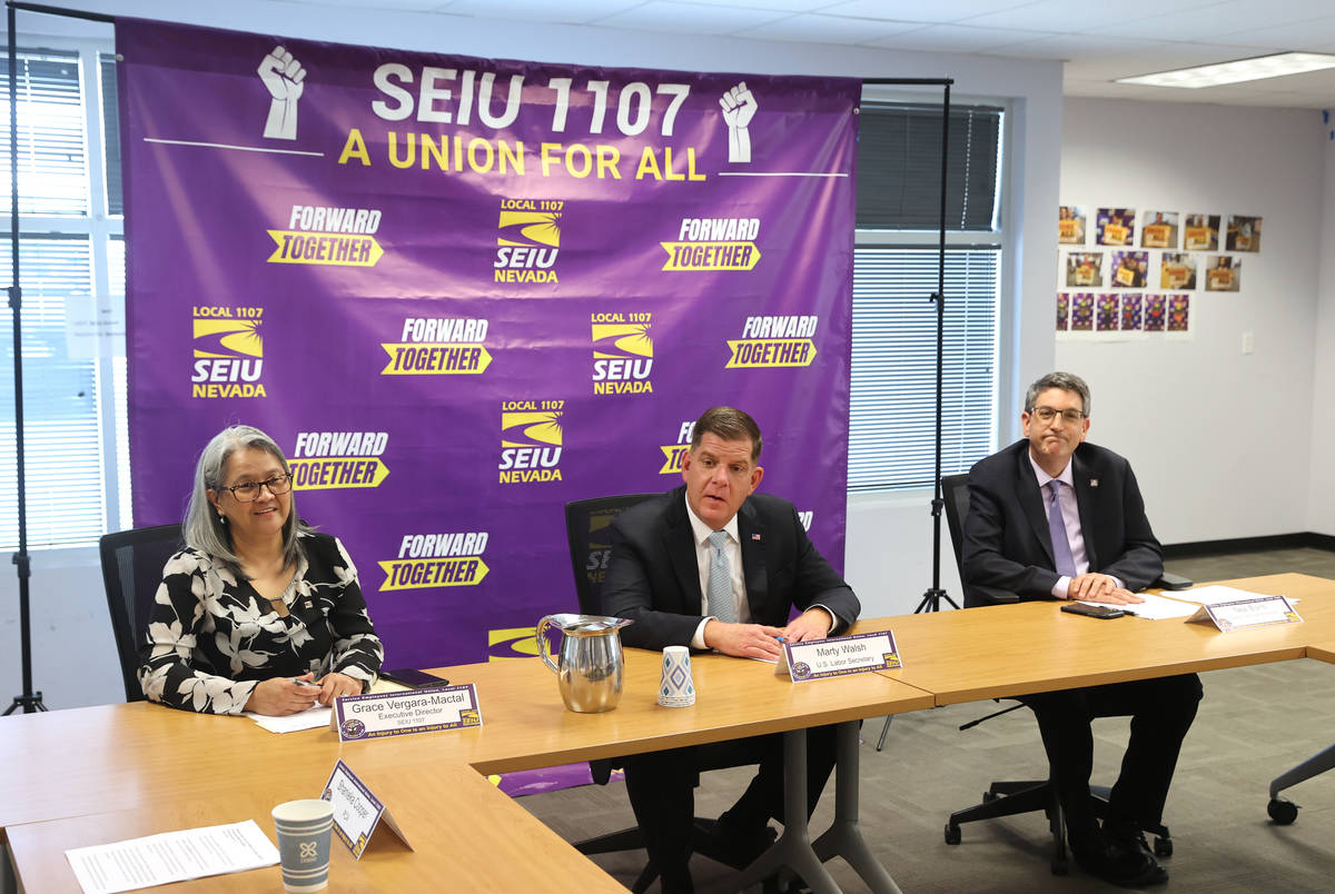 U.S. Secretary of Labor Marty Walsh, center, meets with SEIU Local 1107 labor union members inc ...