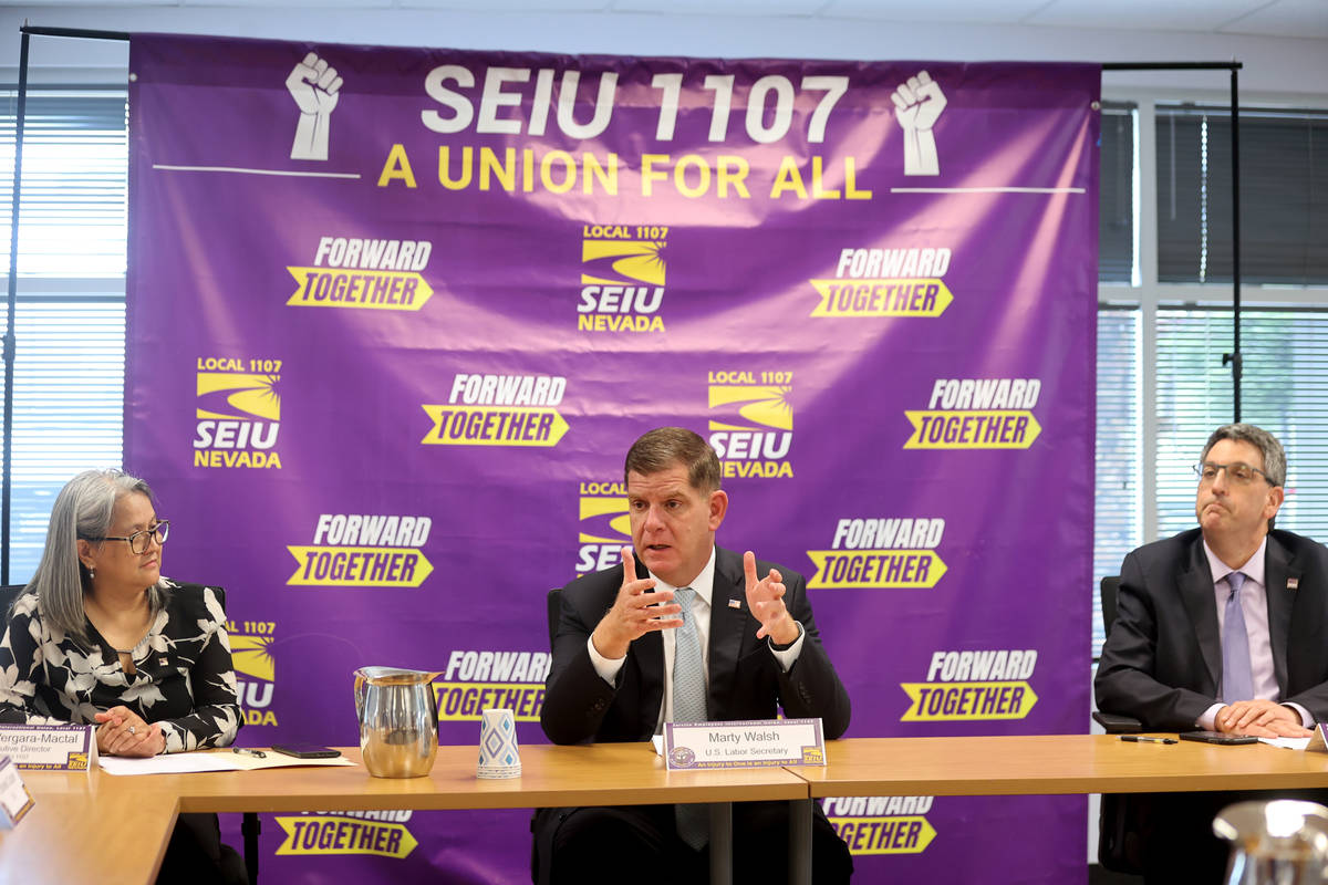 U.S. Secretary of Labor Marty Walsh, center, meets with SEIU Local 1107 labor union members inc ...