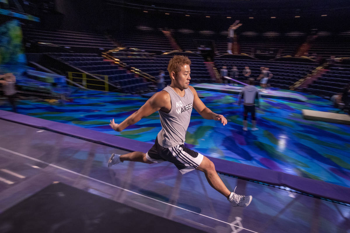 Acrobat Shingo Yokoyama practices leaps on a power track trampoline during rehearsals for &quot ...