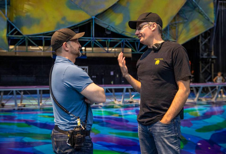 Head coach Paul Cameron, right, talks with coach All-star Booth during a rehearsal of several a ...