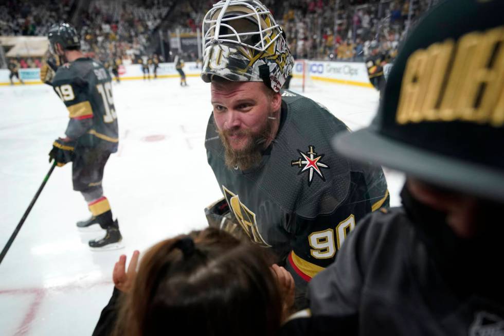 Vegas Golden Knights goaltender Robin Lehner (90) greets his family during warmups before Game ...