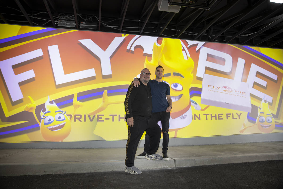 Anthony Zuiker, left, and Scott Godino Jr., co-owners of Fly Pie pizza in Henderson, stand in f ...