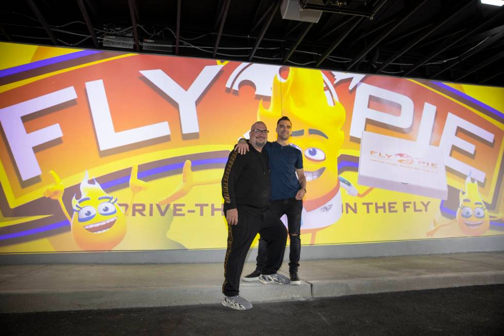 Anthony Zuiker, left, and Scott Godino Jr., co-owners of Fly Pie pizza in Henderson, stand in f ...