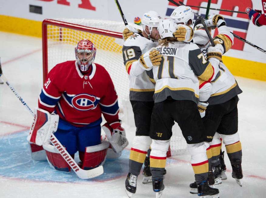 Vegas Golden Knights' Alec Martinez (23) celebrates with teammates after scoring on Montreal Ca ...