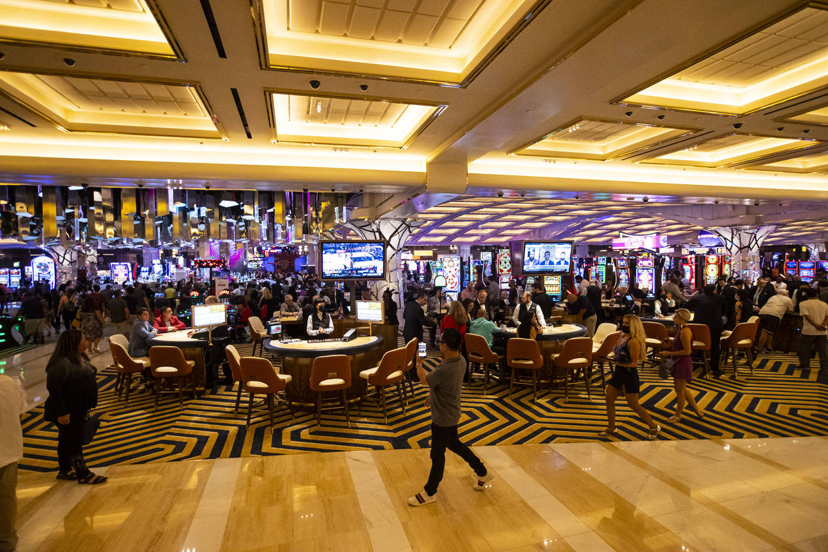 People walk by the casino floor as Resorts World Las Vegas opens to the public on Thursday, Jun ...