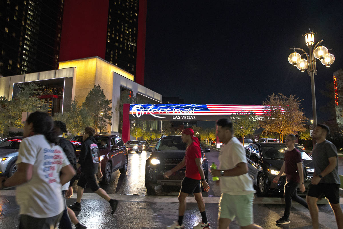 Pedestrians cross Las Vegas Boulevard at Resorts World Avenue outside Resorts World Las Vegas o ...